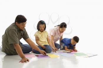 Royalty Free Photo of Parents Coloring With Their Children