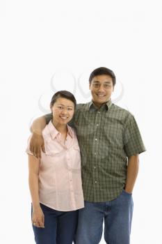 Royalty Free Photo of a Man and Woman Standing With Their Arms Around Each Other