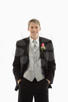 Royalty Free Photo of a Groom With Hands in Pockets