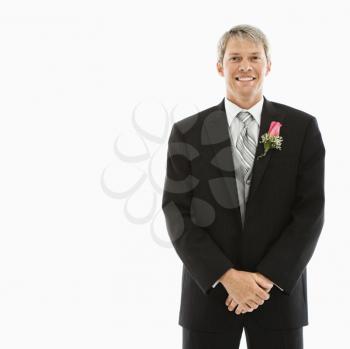 Royalty Free Photo of a Groom in a Tuxedo Wearing a Boutonniere