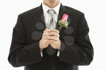 Royalty Free Photo of a Close-up of a Groom With Clenched Fists