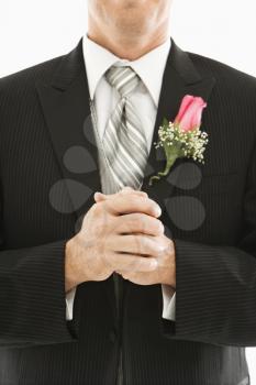 Royalty Free Photo of a Close-up of a Groom With Clenched Fists