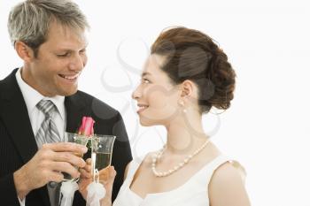 Royalty Free Photo of a Groom and Bride Toasting With Champagne Glasses