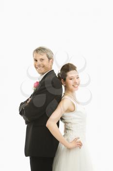 Royalty Free Photo of a Groom and Bride Standing Back to Back