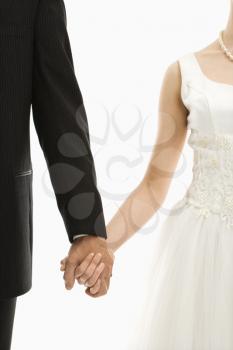 Royalty Free Photo of a Groom and Bride Holding Hands