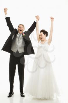 Royalty Free Photo of a Portrait of a Groom and Bride Cheering