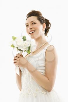 Royalty Free Photo of an Asian Bride Holding a Bouquet