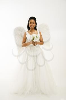 Royalty Free Photo of a Bride Wearing Angel Wings Smiling