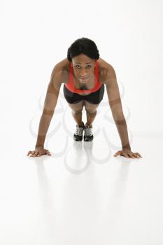 Royalty Free Photo of a Woman Doing Push-Ups