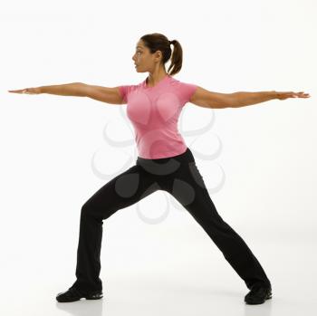 Royalty Free Photo of a Woman Standing in Yoga Warrior Pose