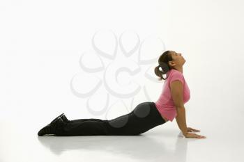 Royalty Free Photo of a Woman Wearing Exercise Clothing in Holding the Cobra Yoga Pose