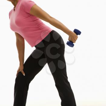 Royalty Free Photo of a Woman Exercising With a Dumbbell