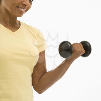 Royalty Free Photo of a Woman Doing Arm Curls and Smiling