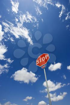 Royalty Free Photo of Stop Sign With Blue Cloudy Sky
