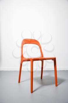 Royalty Free Photo of An Orange Modern Chair With a White Background