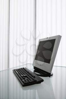 Royalty Free Photo of a Flat Screen Computer Monitor and Keyboard on a Desk