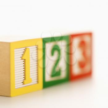 Royalty Free Photo of a Row of Toy Building Blocks With Numbers