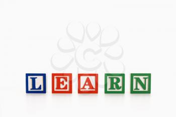 Royalty Free Photo of Alphabet Toy Building Blocks Spelling the Word Learn