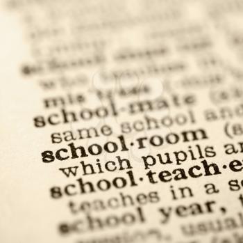 Royalty Free Photo of a Selective Focus of a Dictionary Definition for The Word Schoolroom