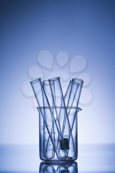 Royalty Free Photo of Test Tubes in a Glass Beaker