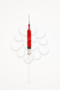 Royalty Free Photo of a Hypodermic Needle Filled With Red Liquid