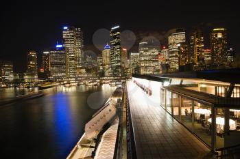Royalty Free Photo of a Night Cityscape With Buildings and Harbor in Sydney, Australia