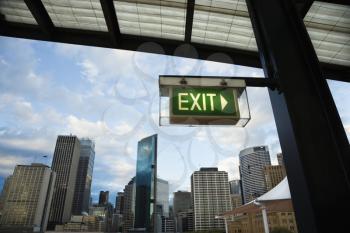 Royalty Free Photo of an Exit Sign With a View of Buildings in Downtown Sydney, Australia