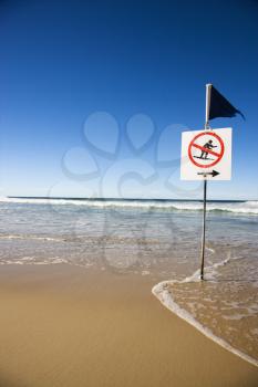 No surfing sign on beach in Surfers Paradise, Australia.