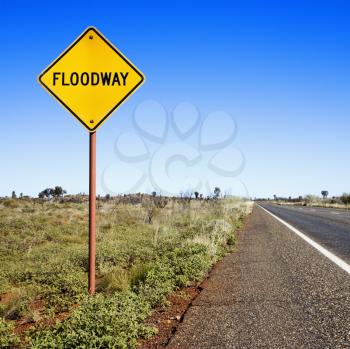 Royalty Free Photo of a Floodway Sign by Road in Rural Australia