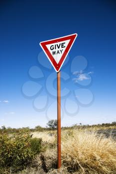 Royalty Free Photo of a Road Sign Reading Give Way in Rural Australia