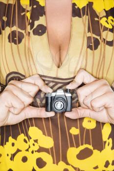 Royalty Free Photo of a Woman Holding a Toy Camera