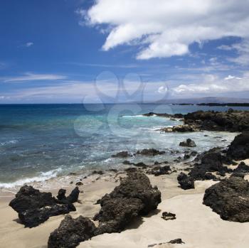 Royalty Free Photo of a Beach in Maui, Hawaii With Lava Rocks