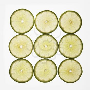 Royalty Free Photo of Lime Slices Arranged in a Square Design