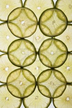 Royalty Free Photo of Lime Slices Arranged in a Design