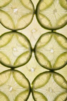 Royalty Free Photo of Lime Slices Arranged in a Design