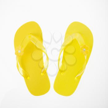 Royalty Free Photo of a Pair pf Yellow Plastic Thong Sandals