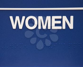 Royalty Free Photo of a Blue Women Sign With Braille