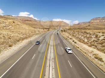 Royalty Free Photo of a a Birds Eye View of Automobiles on a Rural Desert Highway