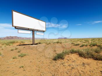 Royalty Free Photo of a Blank Billboard in the Desert