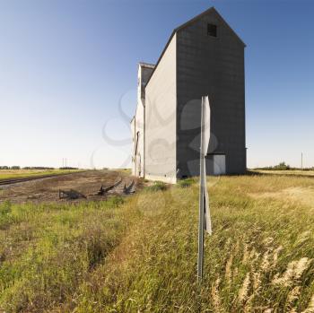 Royalty Free Photo of an Agricultural Grain Elevator in a Rural Field