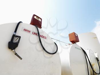 Royalty Free Photo of Fuel Tanks Labeled Unleaded and Ethanol and Pumps