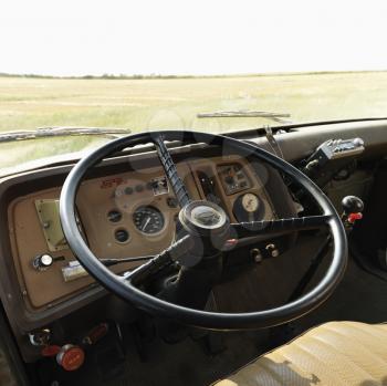 Royalty Free Photo of an Interior of a Farm Truck in a Field