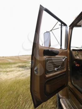 Royalty Free Photo of a Farm Truck With the Driver Side Door Open