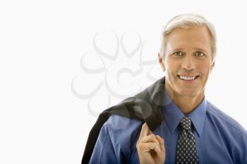 Royalty Free Photo of a Businessman With His Jacket Draped Over His Shoulder