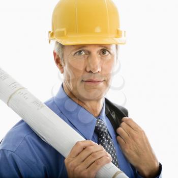 Royalty Free Photo of a Middle-Aged Businessman Holding Blueprints and Wearing a Hard Hat