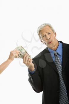 Royalty Free Photo of a Woman Taking Money from a Businessman