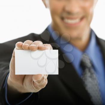 Royalty Free Photo of a Middle-aged Man Holding a Business Card Out