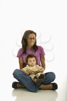 Royalty Free Photo of a Mother Sitting with Her Toddler Son on Lap 