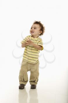 Royalty Free Photo of an African American Toddler Boy Standing Smiling