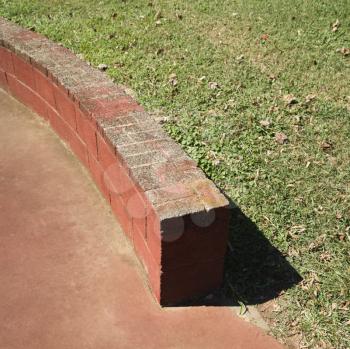 Royalty Free Photo of a Low Brick Wall in a Park